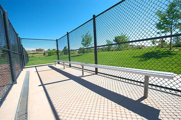 Empty baseball dugout a local park.