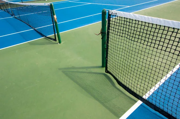 Abstract wide angle view of a pickle ball or tennis court with two nets.