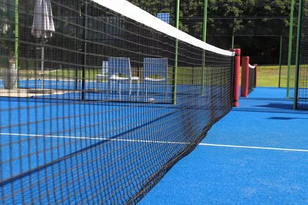 padel net on tennis court, close-up. Sport background